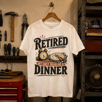 White vintage t-shirt hanging with printed RETIRED and My Only Deadline Is Dinner design
