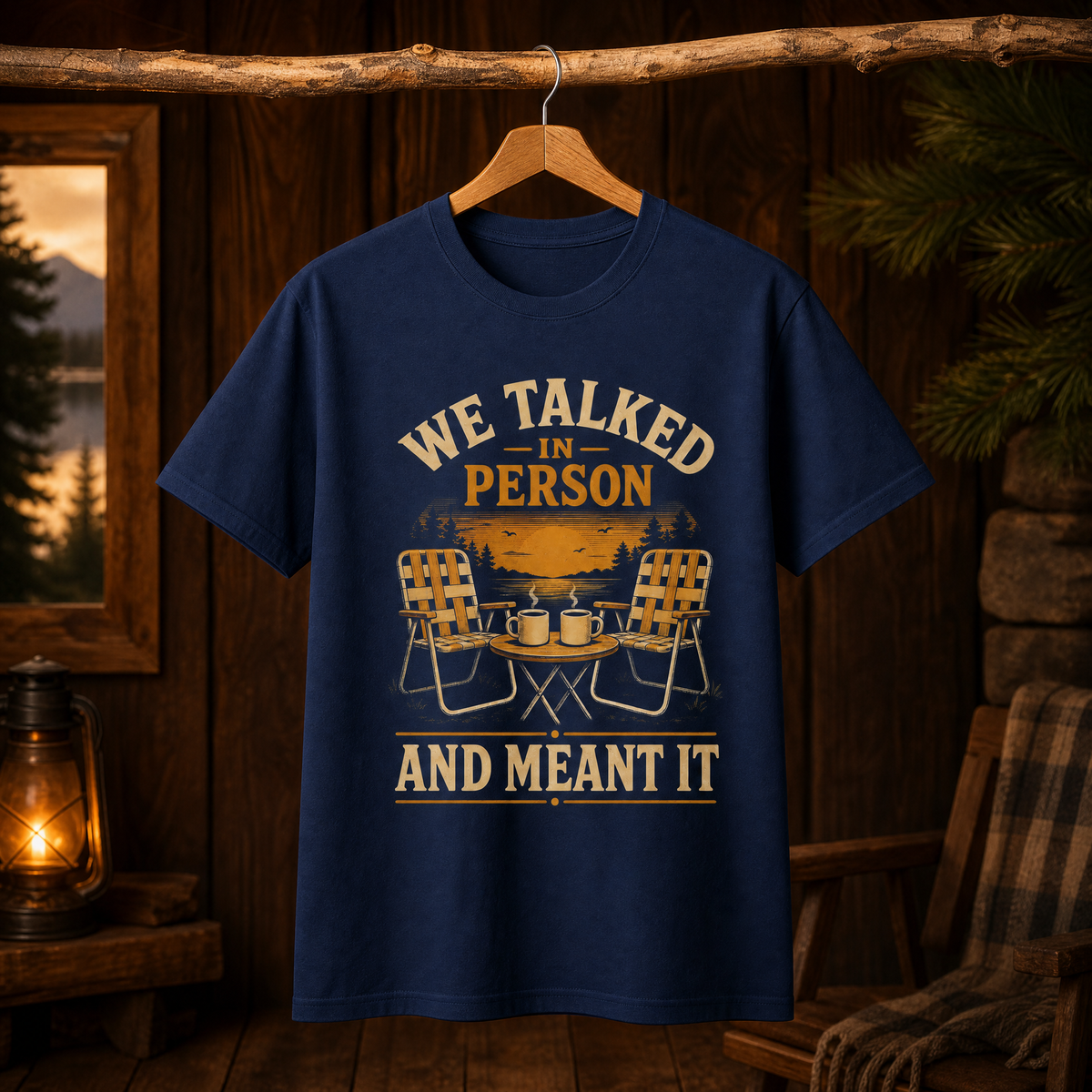 Navy vintage T-shirt hanging with printed “WE TALKED IN PERSON” lakeside chair design