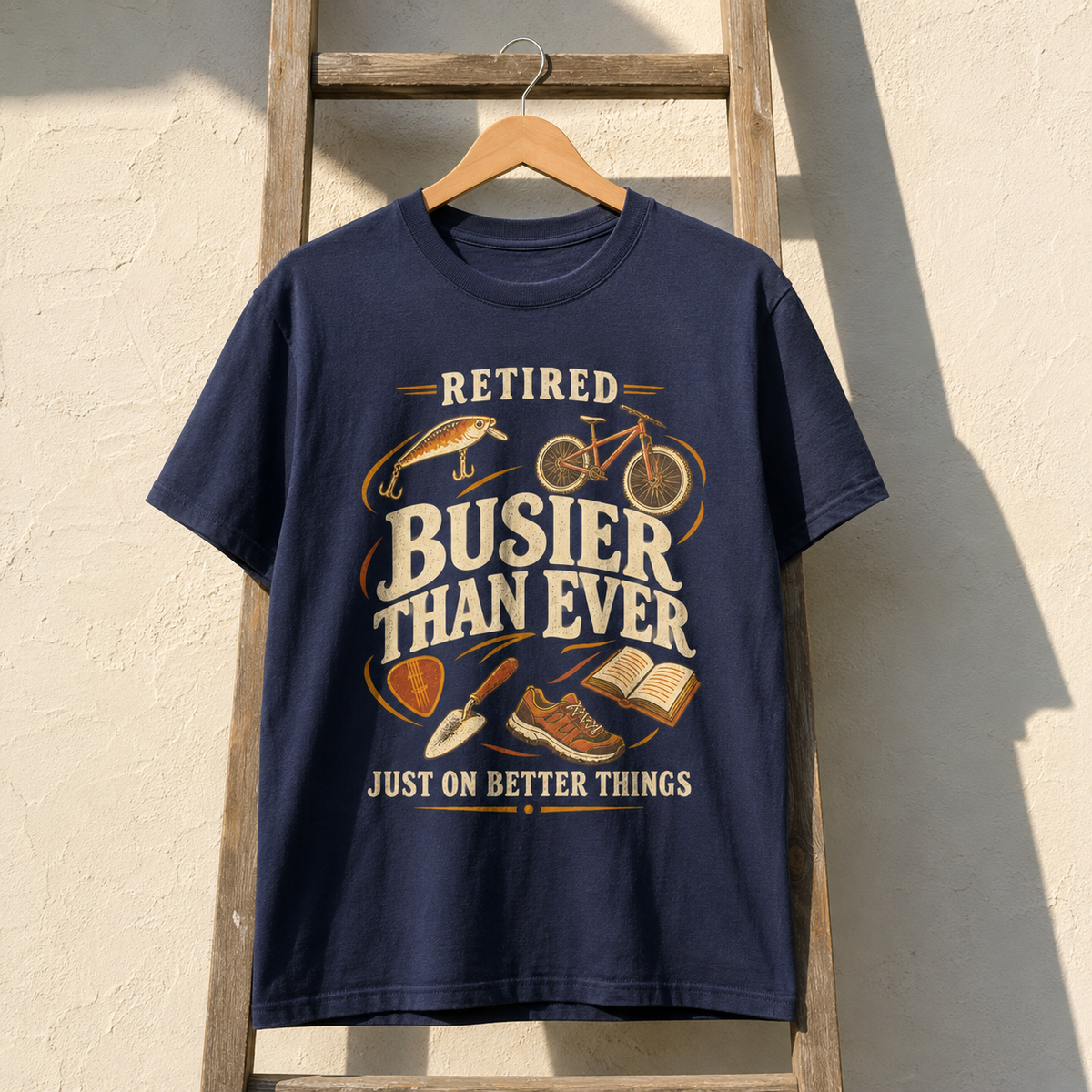 Navy vintage t-shirt hanging with printed Retired Busier Than Ever Just On Better Things design