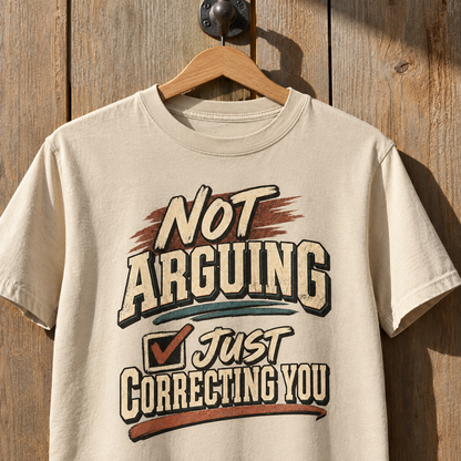 Cream vintage t-shirt hanging with printed “Not Arguing. Just Correcting You” slogan on front