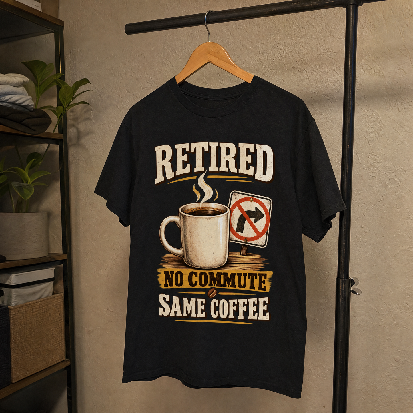 Black vintage t-shirt hanging with printed Retired No Commute Same Coffee slogan design