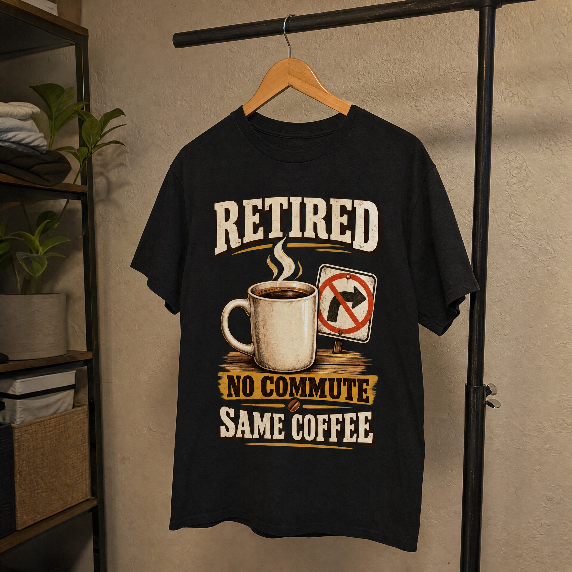 Black vintage t-shirt hanging with printed Retired No Commute Same Coffee slogan design