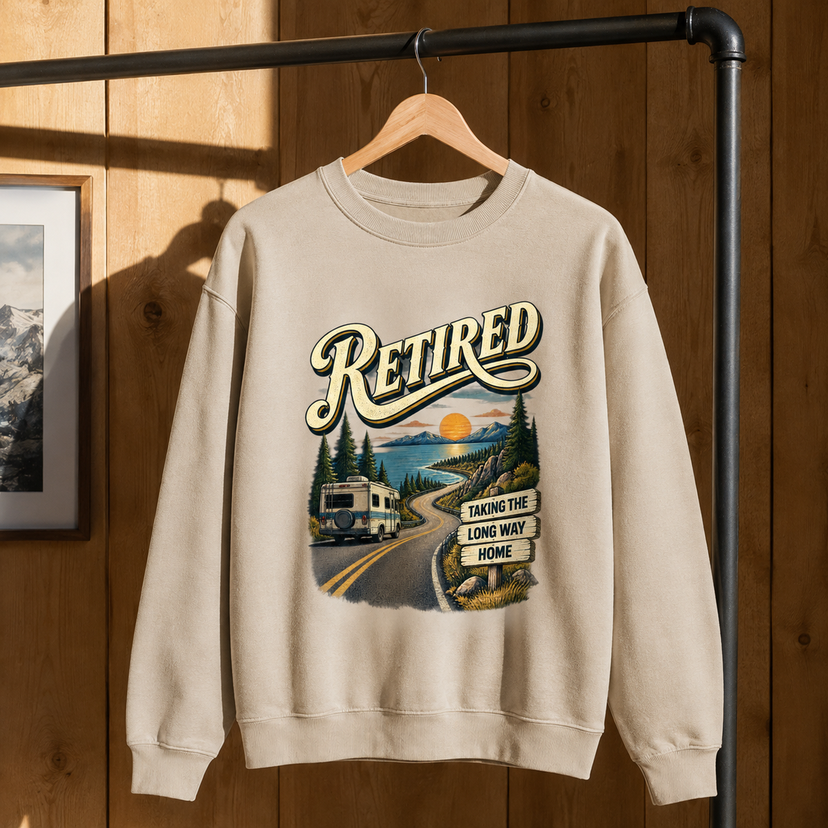 Cream vintage sweatshirt hanging with printed Retired and Taking The Long Way Home design
