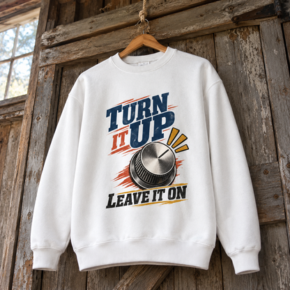 Vintage sweatshirt hanging with printed Turn It Up. Leave It On slogan and knob graphic