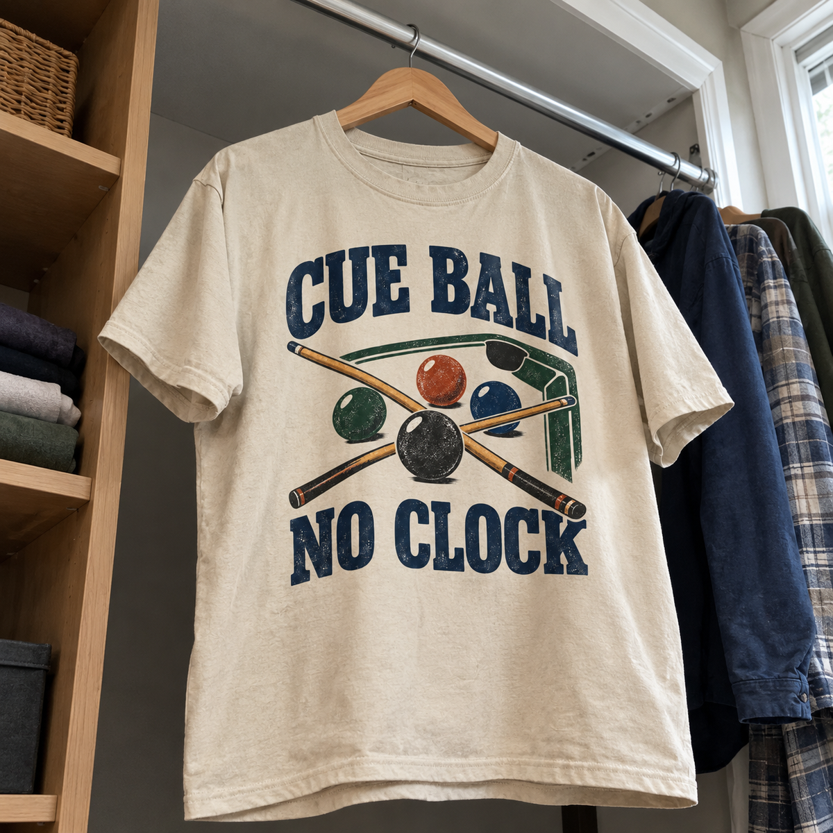 Cream vintage t-shirt hanging with printed cue balls and pool cues, slogan Cue Ball No Clock