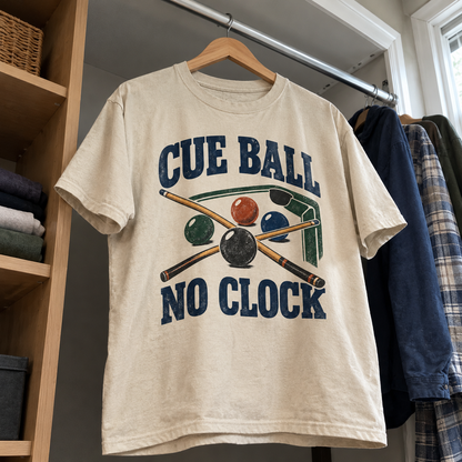 Cream vintage t-shirt hanging with printed cue balls and pool cues, slogan Cue Ball No Clock