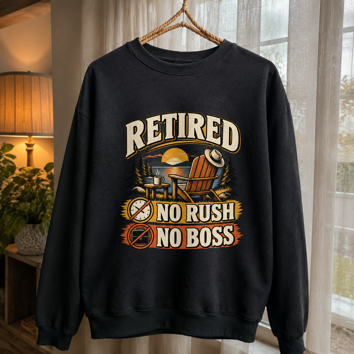 Black vintage sweatshirt hanging with printed Retired No Rush No Boss slogan design