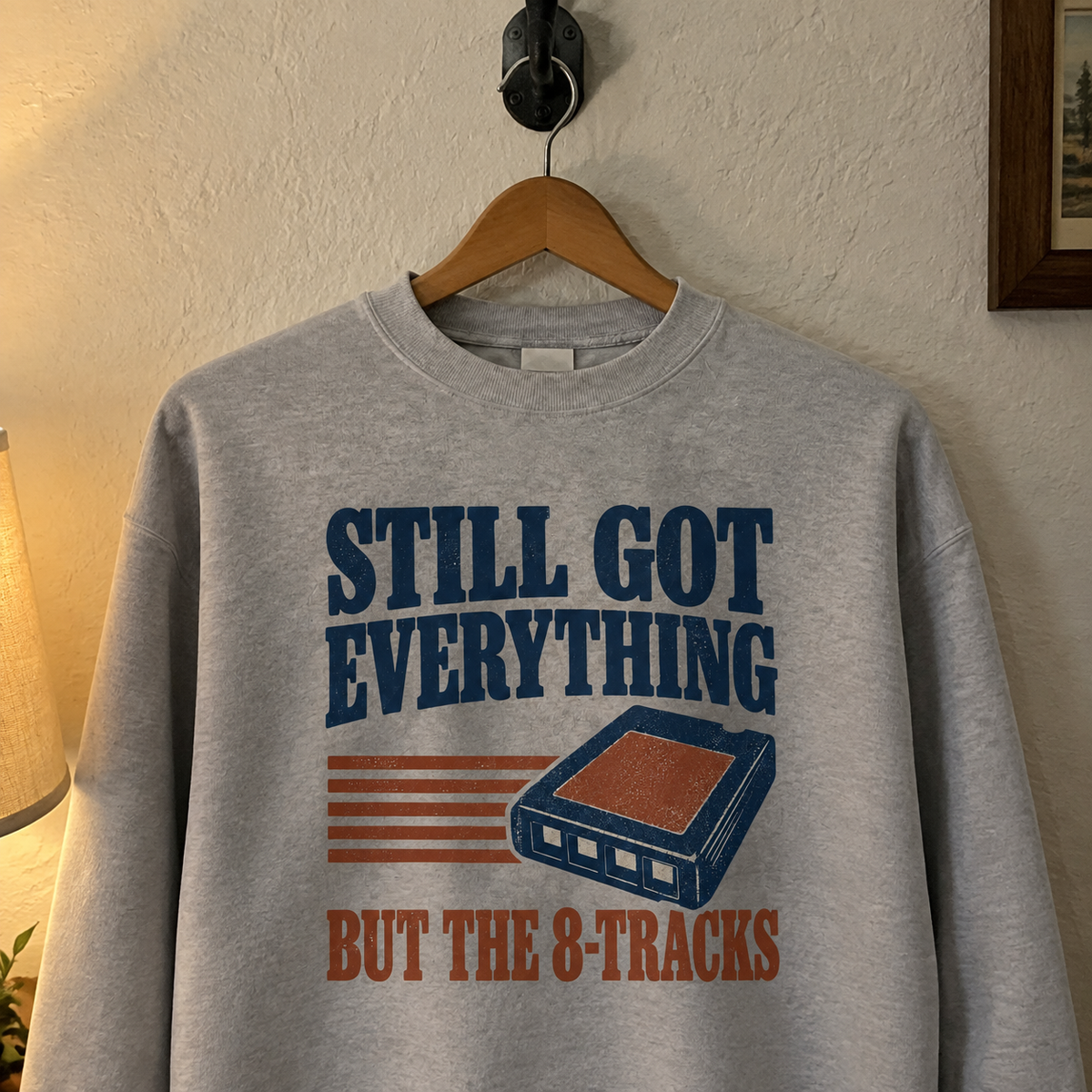 Gray vintage sweatshirt with printed “Still Got Everything But The 8-Tracks” design, hanging front view