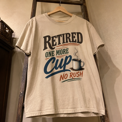 Hanging cream vintage t-shirt with printed Retired One More Cup No Rush slogan design