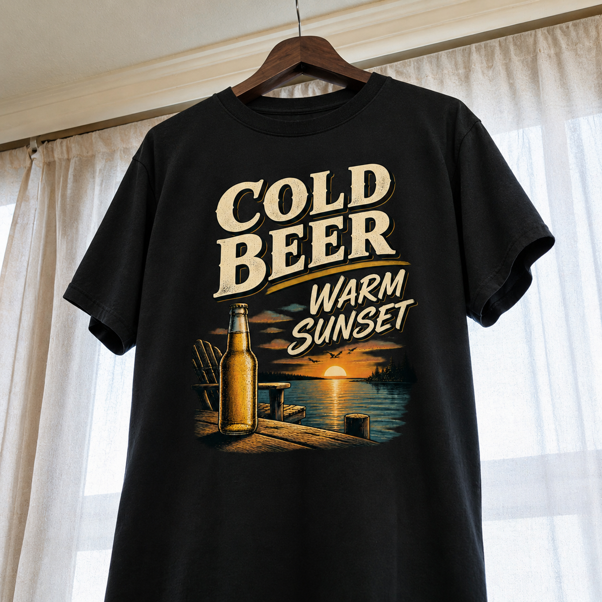 Black vintage t-shirt hanging with Cold Beer Warm Sunset printed lake sunset design