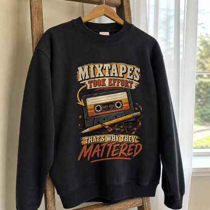Black vintage sweatshirt hanging with printed mixtape slogan and cassette design.
