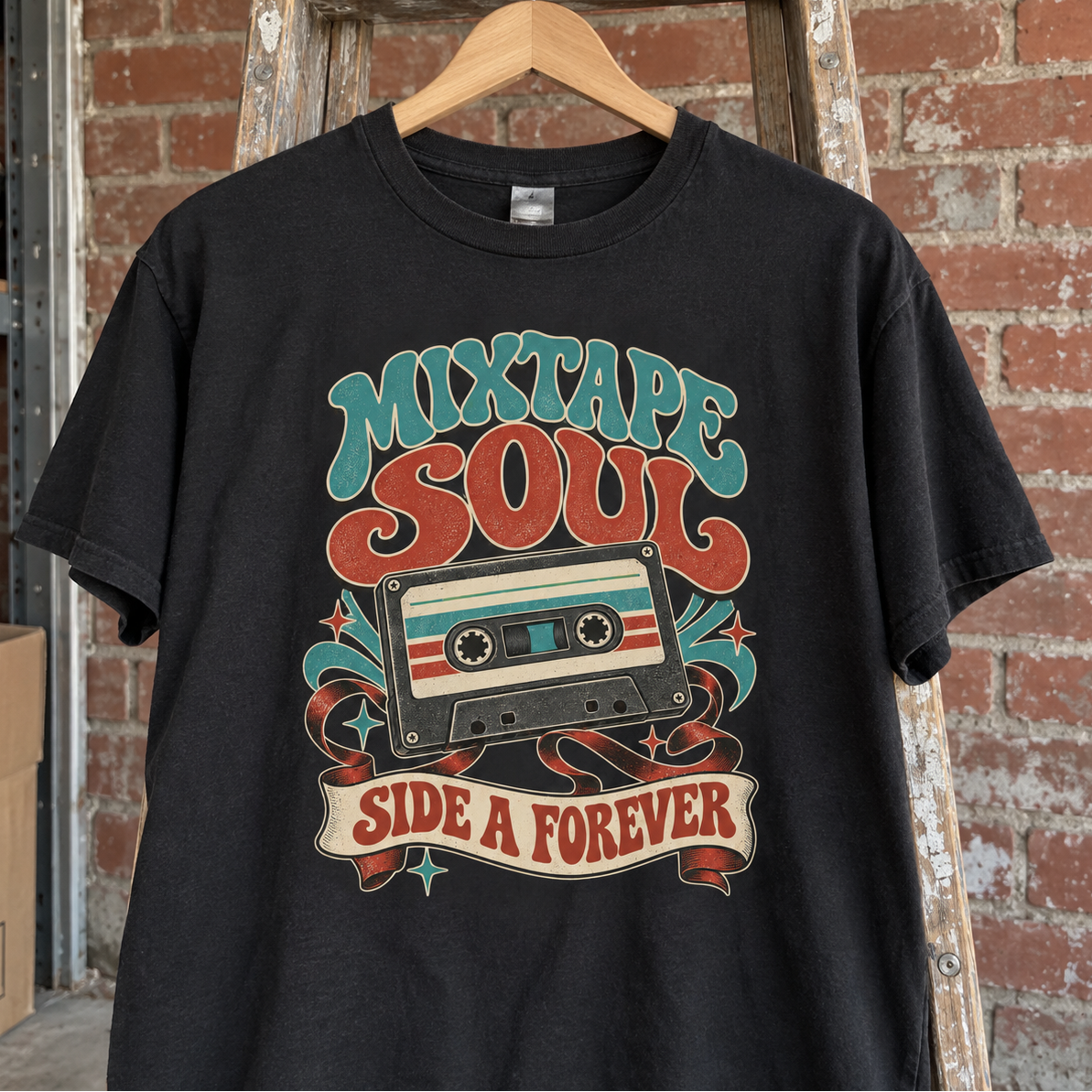 Black vintage t-shirt hanging against brick wall with printed Mixtape Soul Side A Forever design