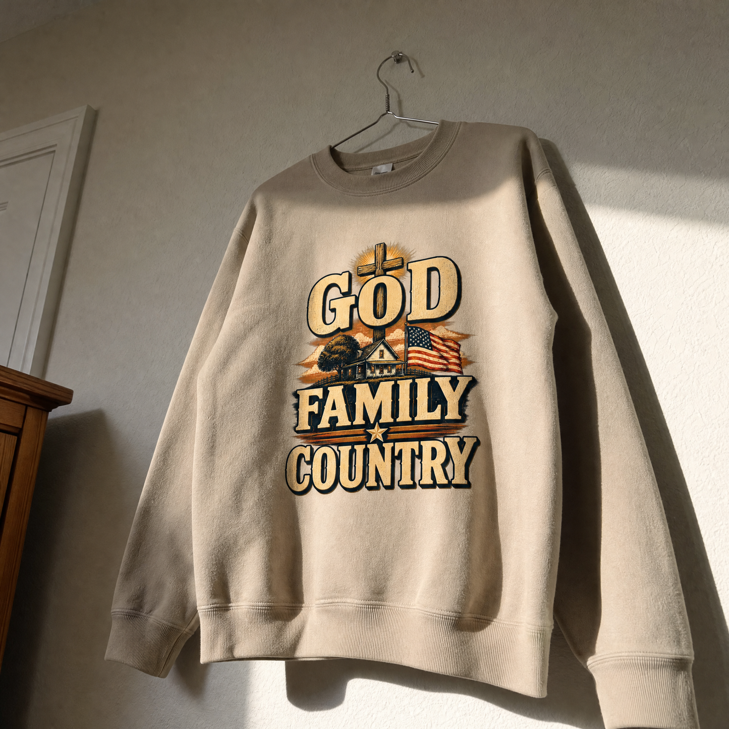 Beige vintage sweatshirt hanging with printed God Family Country patriotic farmhouse design.