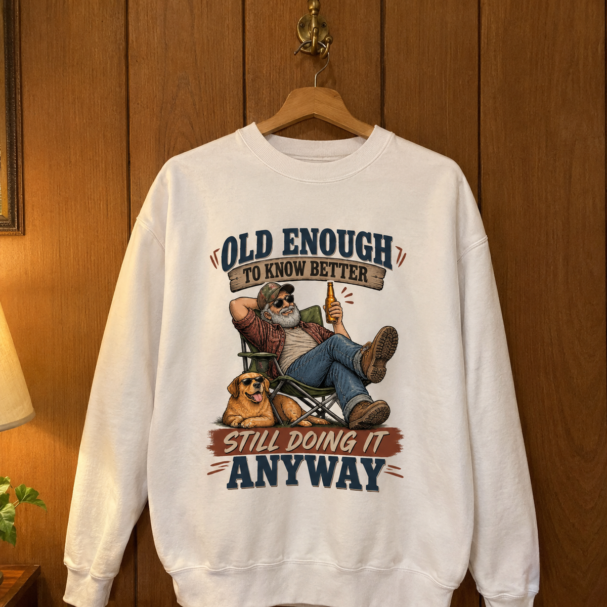 White vintage sweatshirt hanging with printed Old Enough To Know Better slogan