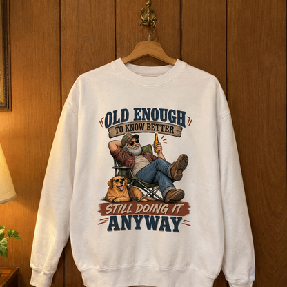 White vintage sweatshirt hanging with printed Old Enough To Know Better slogan
