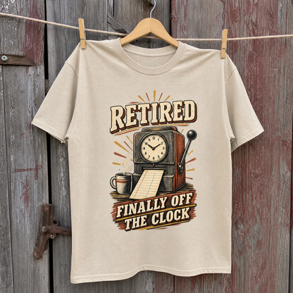 Beige vintage t-shirt with printed “Retired Finally Off The Clock” design, hanging front view