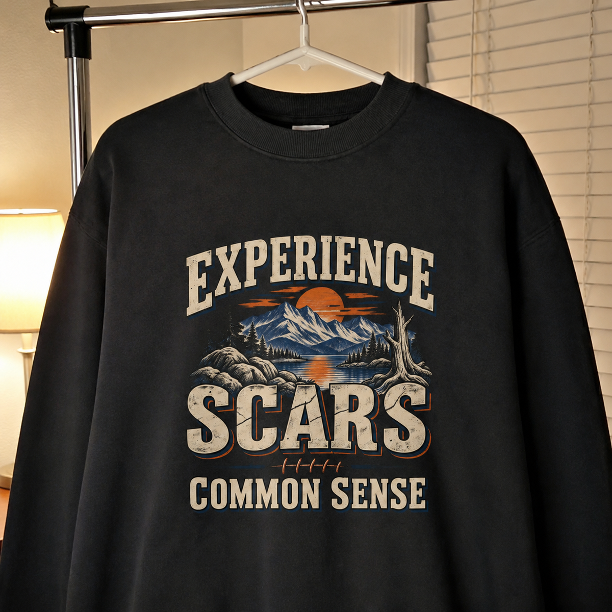 Black vintage sweatshirt with Experience Scars Common Sense printed design, hanging front view