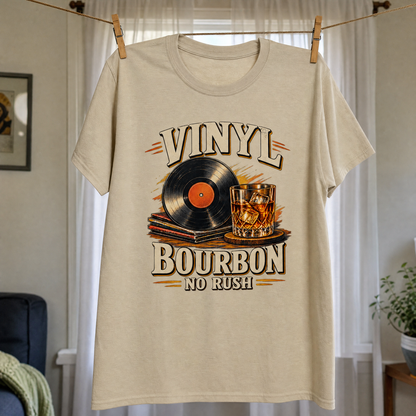 Beige vintage t-shirt hanging with printed Vinyl Bourbon No Rush record and bourbon glass design