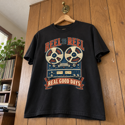Black vintage t-shirt hanging with printed reel-to-reel recorder and Real Good Days slogan