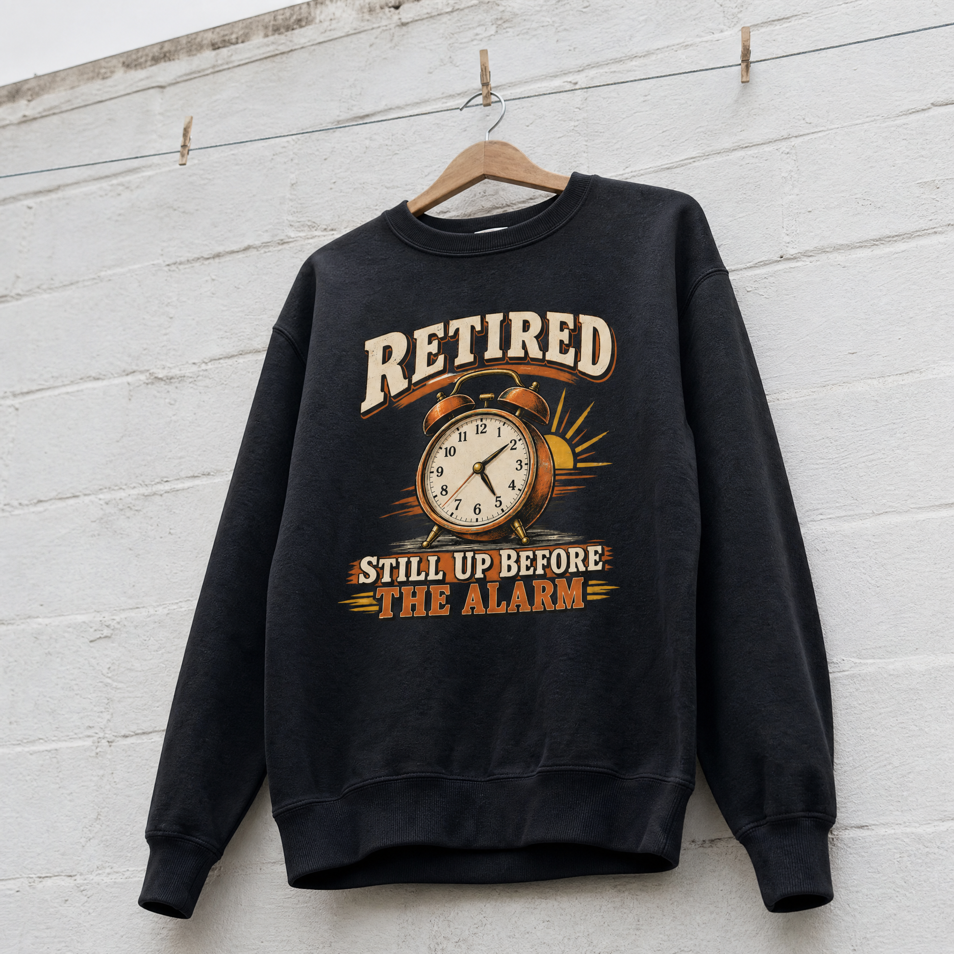 Black vintage sweatshirt hanging with printed Retired Still Up Before The Alarm design
