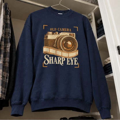 Navy vintage sweatshirt hanging with printed Old Camera Sharp Eye design and retro camera graphic