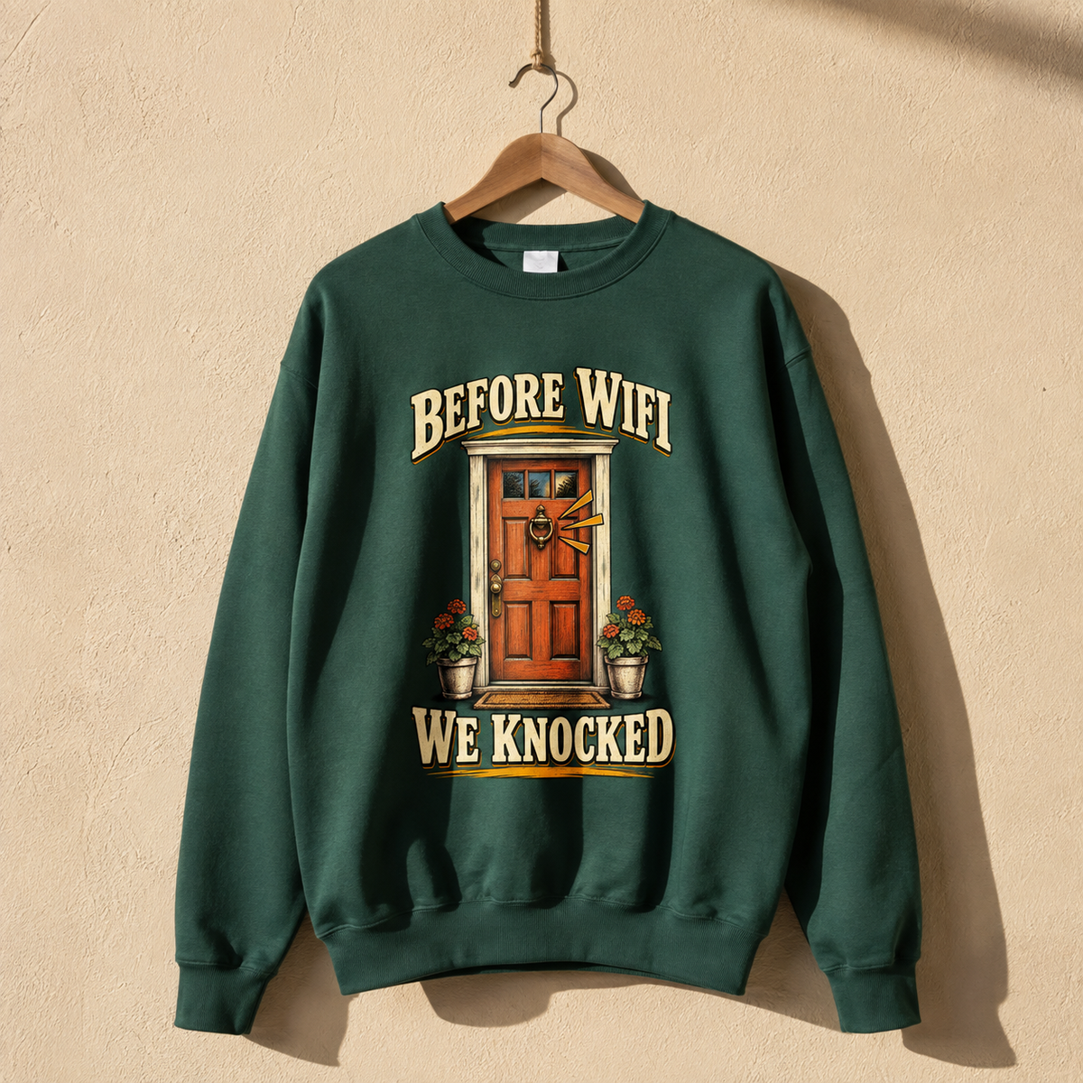 Green vintage sweatshirt hanging with printed Before Wifi We Knocked door design
