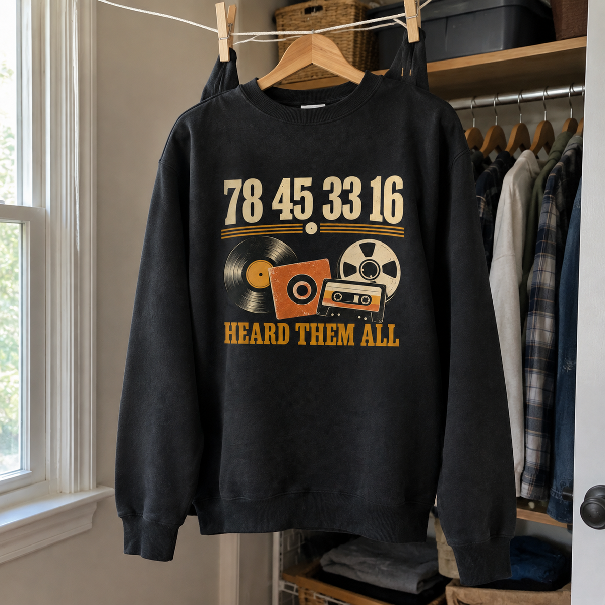 Black vintage sweatshirt hanging with printed “78 45 33 16 Hard Them All” design, front view