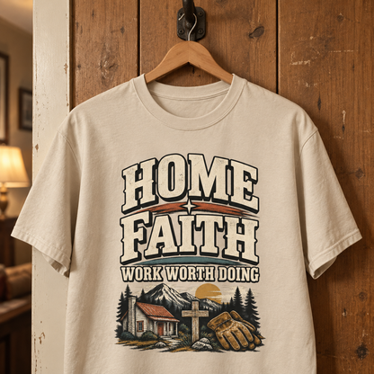 Cream vintage t-shirt hanging on a wooden door with printed Home Faith Work Worth Doing slogan.