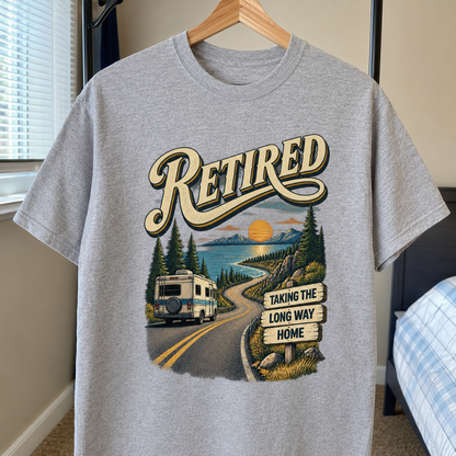 Gray vintage t-shirt printed with Retired and Taking the Long Way Home, hanging