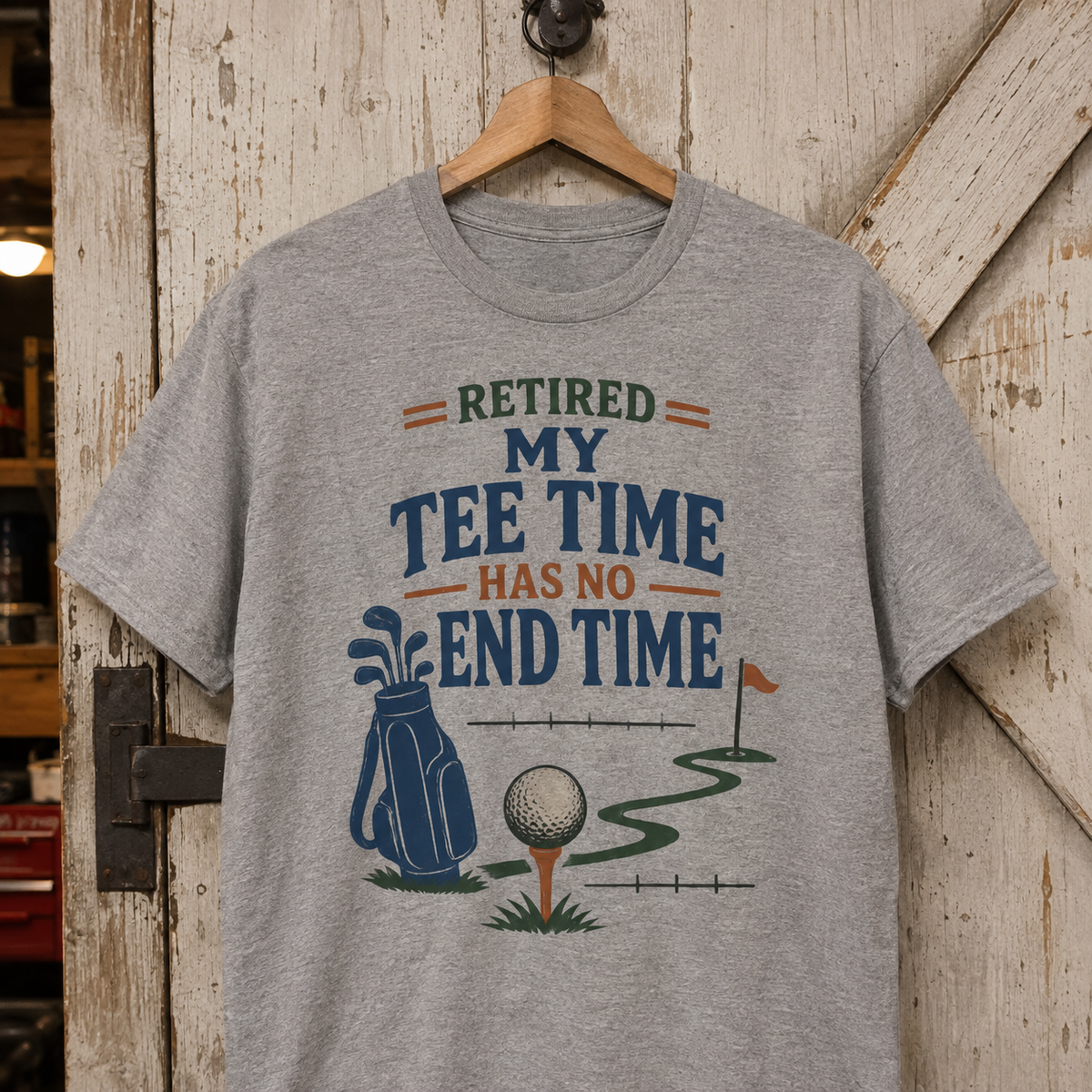 Gray vintage t-shirt hanging with printed Retired My Tee Time golf design