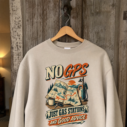 Vintage sweatshirt hanging with printed No GPS Just Gas Stations And Good Advice design.