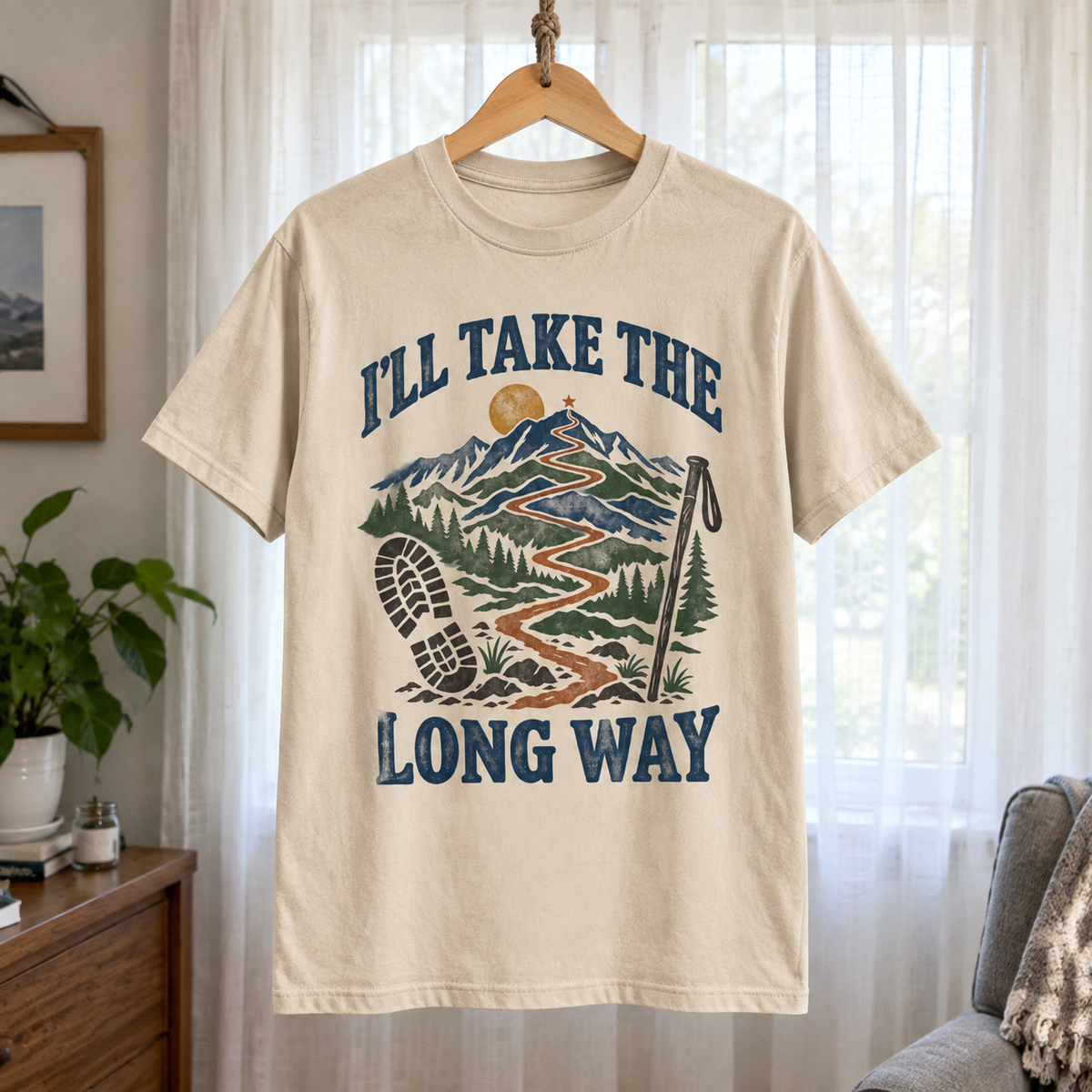 Cream vintage t-shirt hanging with printed I’LL TAKE THE LONG WAY mountain design