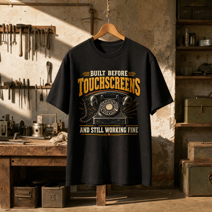 Black vintage t-shirt hanging on hanger with printed vintage telephone design and slogan