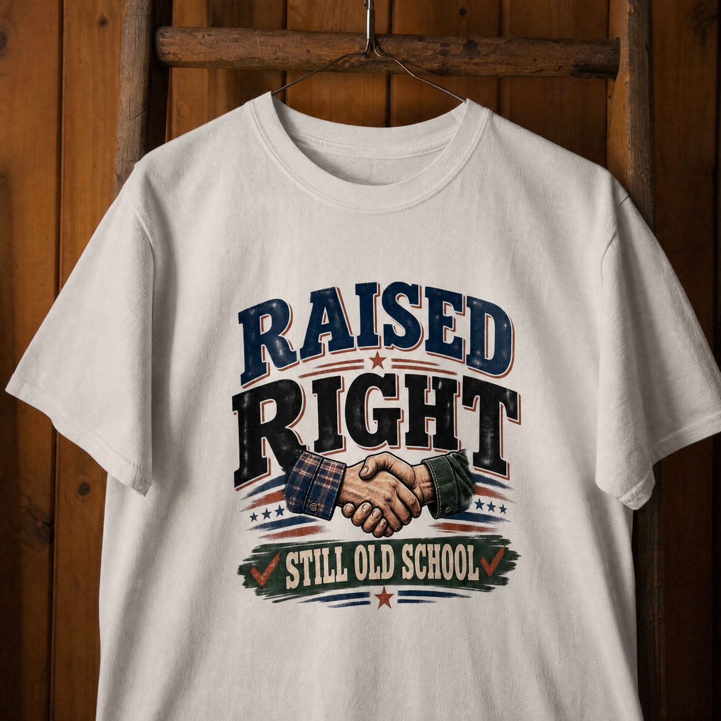 White vintage t-shirt with printed Raised Right Still Old School slogan hanging view