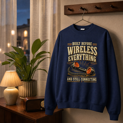 Navy vintage sweatshirt with printed “Built Before Wireless Everything And Still Connecting” slogan, hanging view