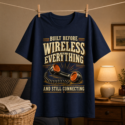 Navy vintage t-shirt hanging with printed Built Before Wireless Everything And Still Connecting telephone design