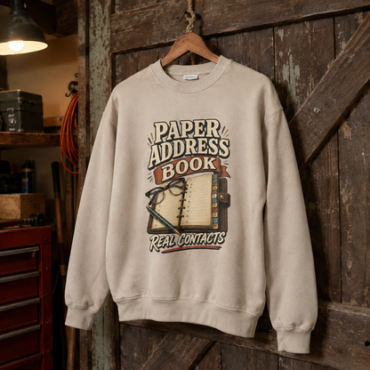 Cream vintage sweatshirt hanging with printed Paper Address Book Real Contacts design
