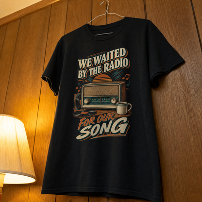 Black vintage t-shirt hanging with printed We Waited By The Radio For Our Song design.