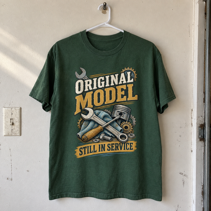 Dark green vintage t-shirt hanging with printed tools and Original Model Still In Service