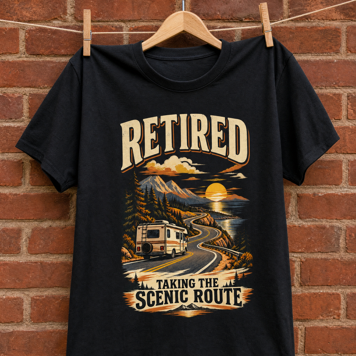 Black vintage t-shirt hanging on a wooden hanger with printed Retired Taking the Scenic Route