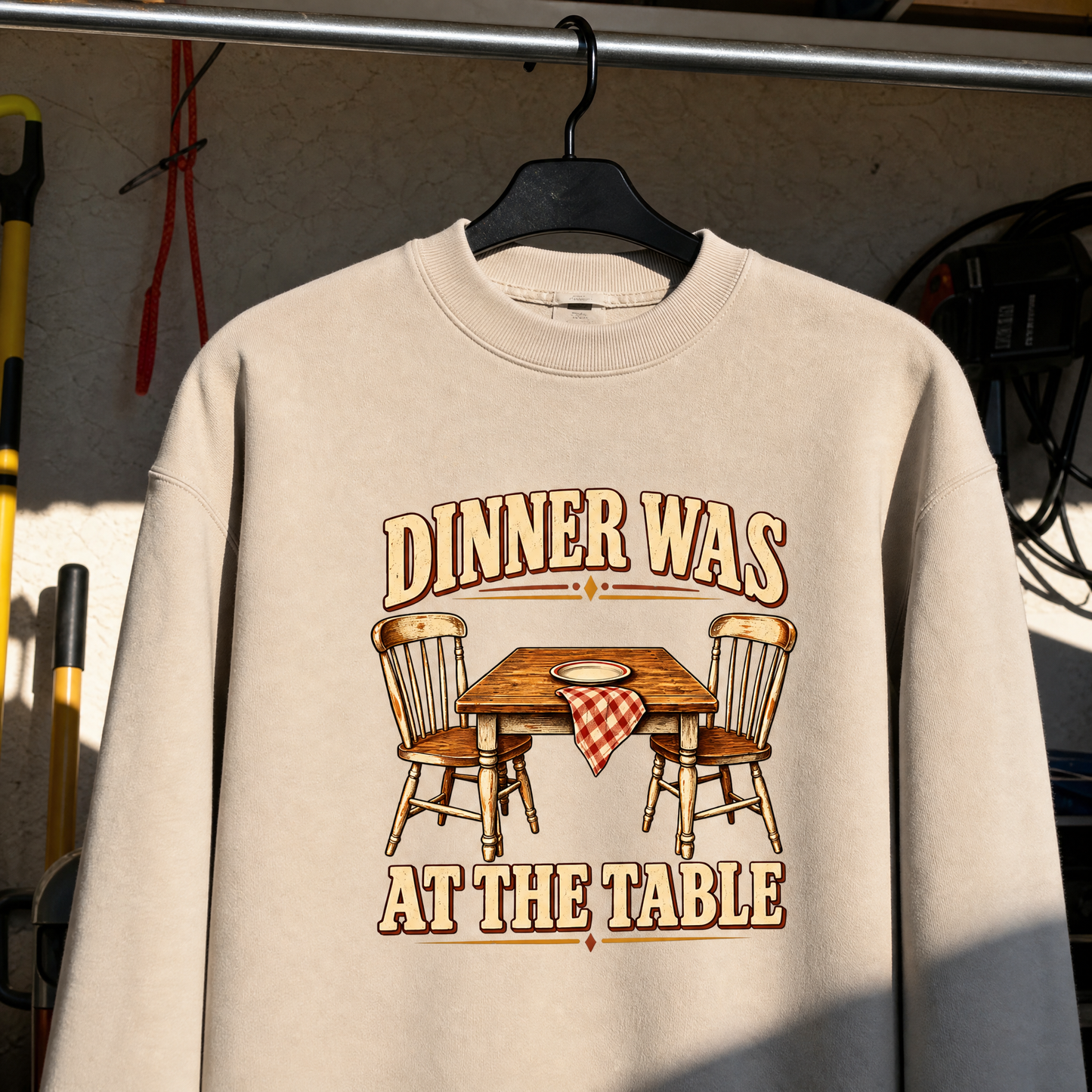 Cream vintage sweatshirt hanging with printed Dinner Was At The Table design