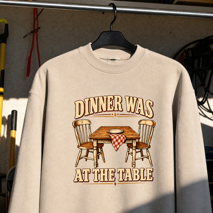 Cream vintage sweatshirt hanging with printed Dinner Was At The Table design