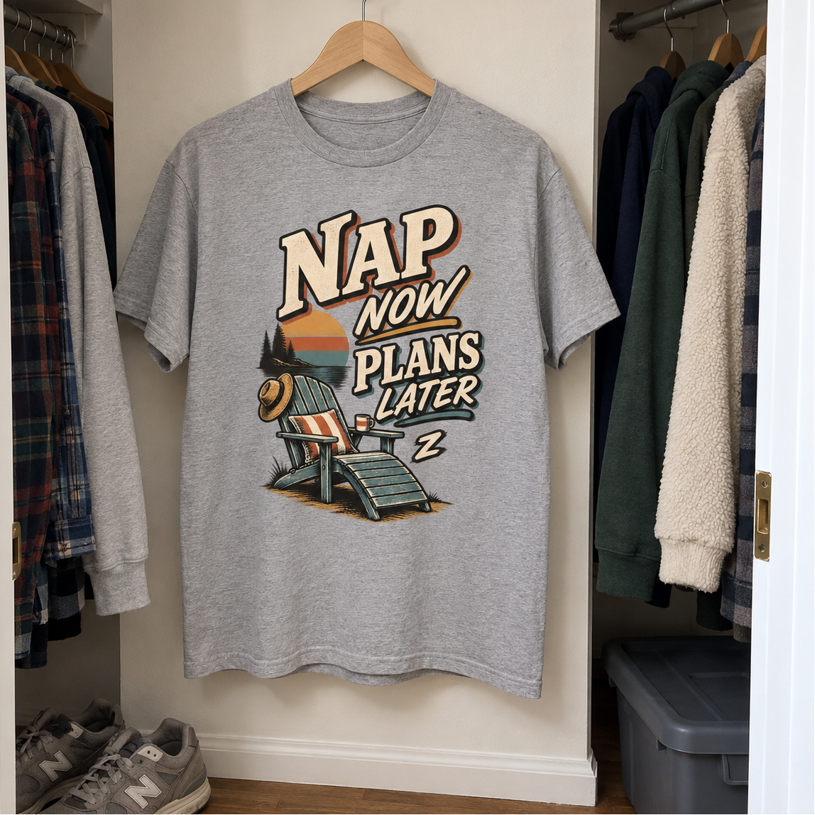 Gray vintage t-shirt hanging in closet with printed Nap Now Plans Later design