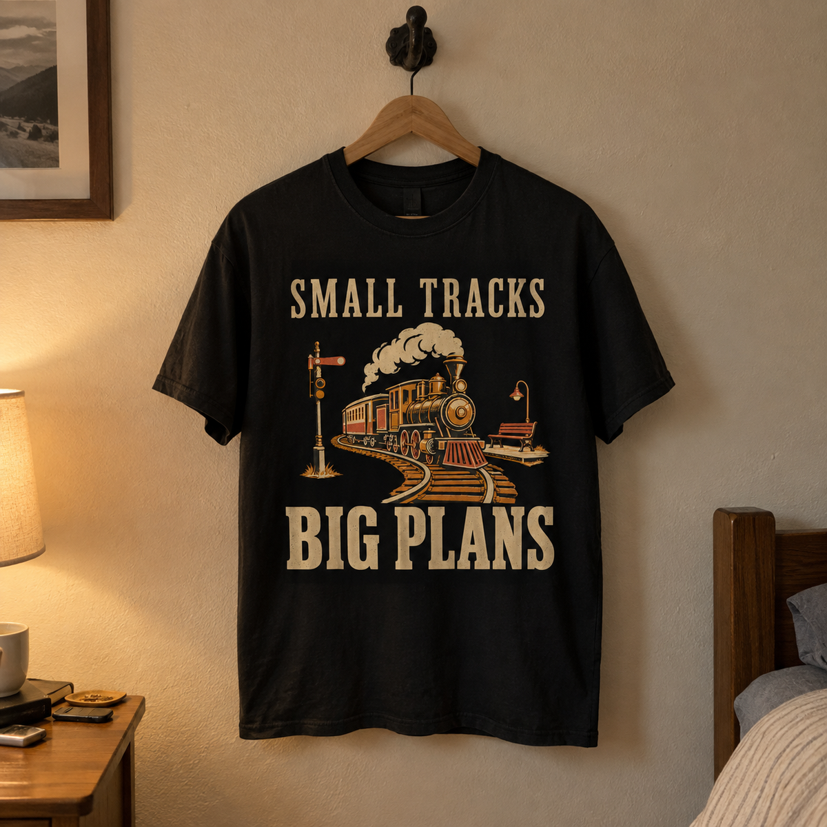 vintage t-shirt on hanger with Small Tracks Big Plans printed design