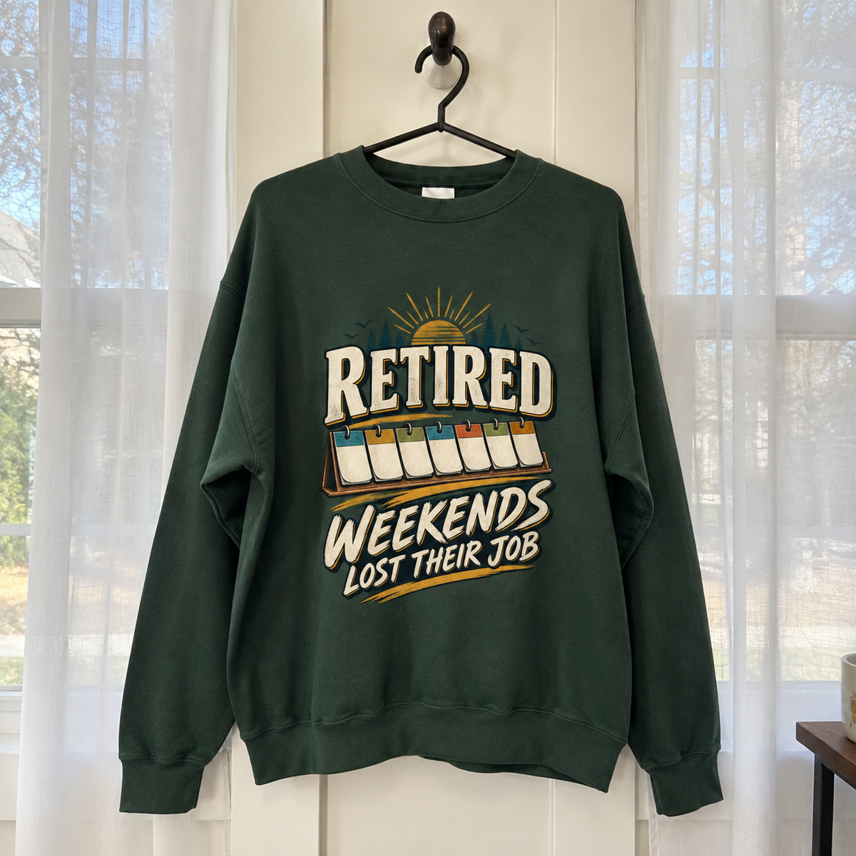 Dark green vintage sweatshirt hanging with Retired Weekends Lost Their Job printed design
