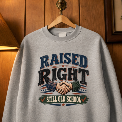 Gray vintage sweatshirt hanging with Raised Right Still Old School printed design