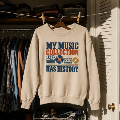 Cream vintage sweatshirt hanging with printed My Music Collection Has History retro music design