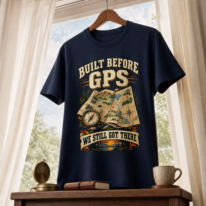 Navy vintage t-shirt hanging by window with printed Built Before GPS We Still Got There design.