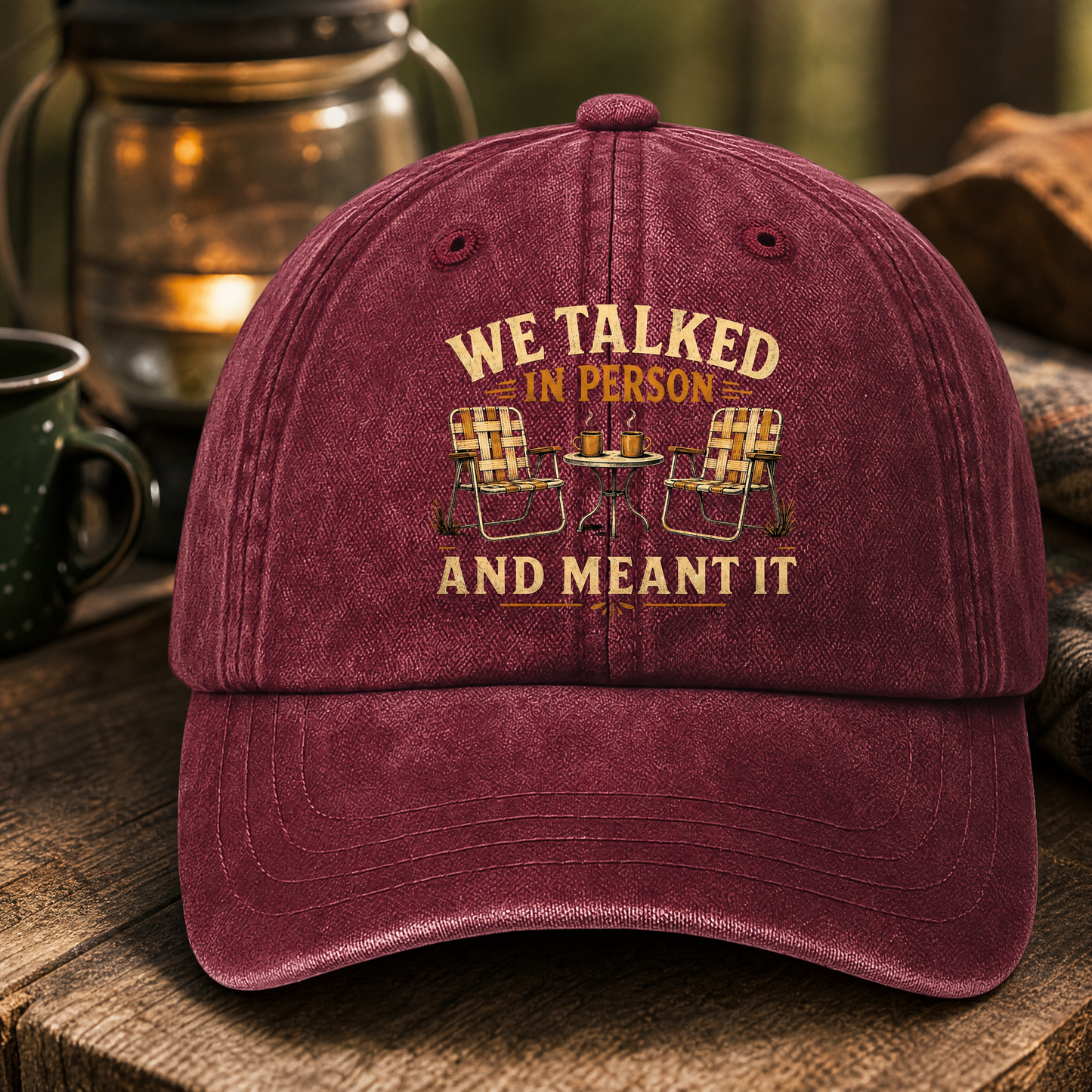 Burgundy vintage washed cap with printed “We talked in person” design, front view.