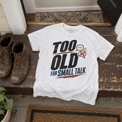 White vintage t-shirt with Too Old For Small Talk print on doorstep beside boots